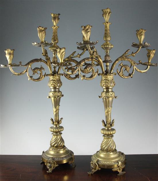 A pair of mid 19th century Continental ormolu five light candelabra, height 28in.